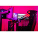 This is the Trak Racer TR160 Full Racing Simulator Setup - SPEC 4 closeup on the upper part of the sample build in a pink-red lit room.