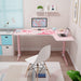 Right-sided Pink L-Shape Desk in a simple realistic room setting with a few peripherals on top.