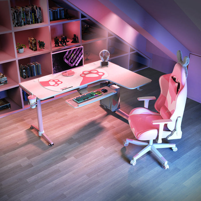 Right-sided Pink L-Shape Desk in a typical gamer's room setting showcasing peripherals around and on top of the desk.