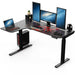 L-Shaped Electric Standing Desk Left-sided with gaming peripherals on top of it.