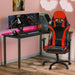 Red GX2 Gaming Chair in a simple realistic room setting with a few peripherals on top.