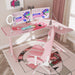 Right-sided Pink L-Shape Desk in a simple room corner setting with a few vlogging peripherals on the desk.