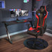 Red GX2 Gaming Chair in a simple realistic gaming room setting with a few peripherals on top.
