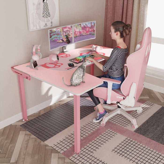 Left-sided Pink L152 60" L-Shape Desk in a simple room corner with a 3D woman sitting on a gaming chair using the keyboard on the desk.