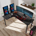 L01 60" L-Shape Desk in a simple realistic setting with 4 monitors on top along with other peripherals.