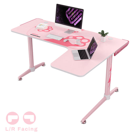 Right-sided Pink L-Shape Desk with a few peripherals on top.