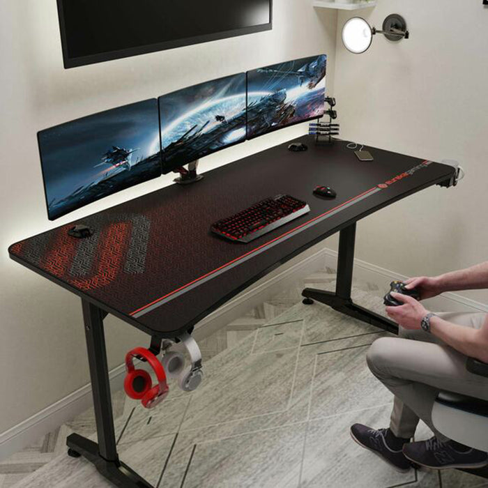 GIP 60" Gaming Desk full view in a realistic setting with someone playing games in front of the unit.