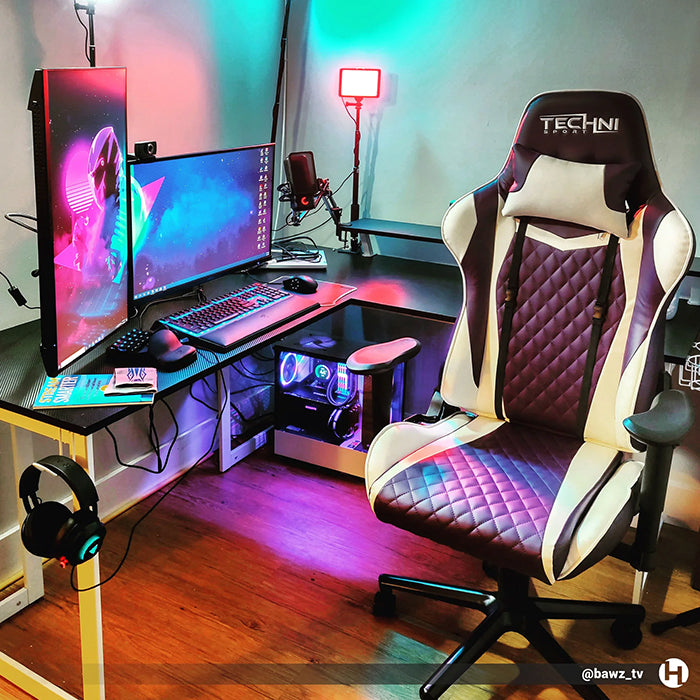 TS-52 Ergonomic High Back Racer Style PC Gaming Chair in front of a complete PC gaming set-up with dual monitors and L-shaped desk.