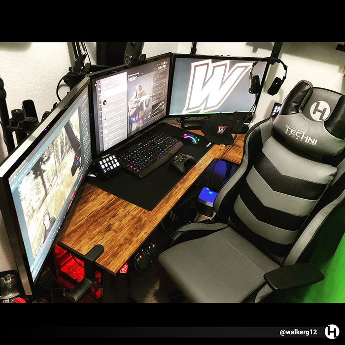 TS-61 Ergonomic High Back Racer Style Video Gaming Chair in front of a triple-monitored PC gaming set-up.