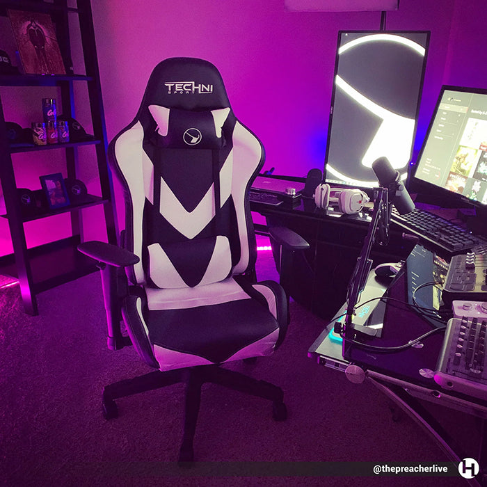 White/Black TS-92 Office-PC Gaming Chair in front of a complicated PC Gaming Set-up in a purple-lit room.